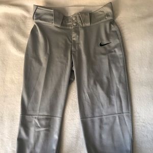 A pair of grey nike women’s softball pants.